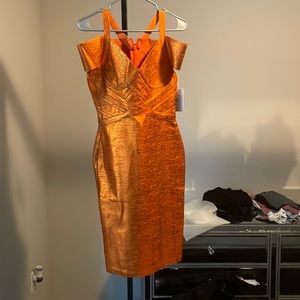 Never worn tag still on it nila orange dress. Cute cocktail dress.